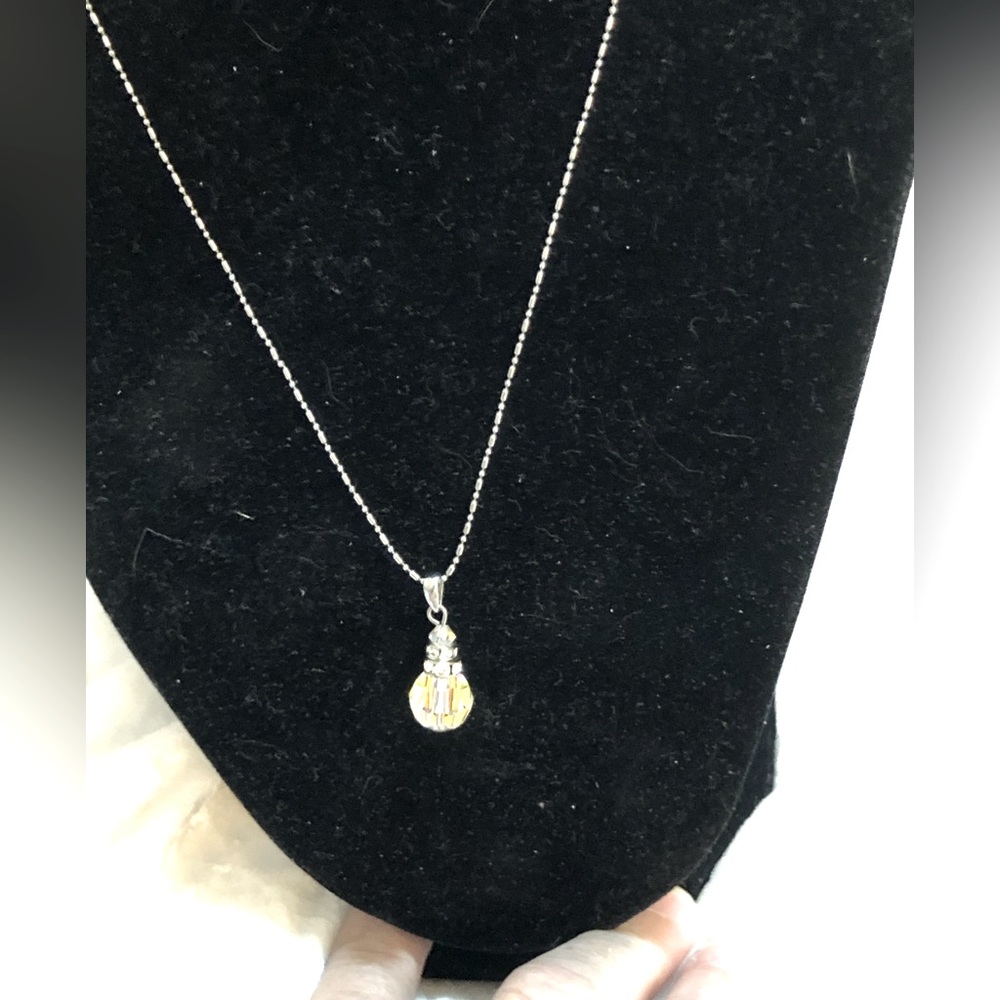 Faceted crystal and silver tear drop necklace.